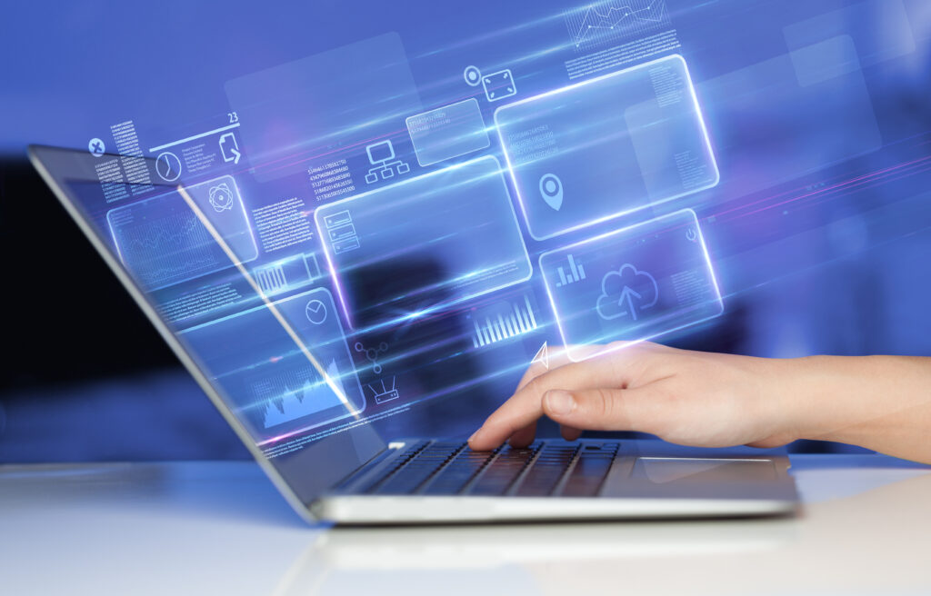 Hand,Using,Laptop,With,Database,Reports,And,Online,Work,Concept